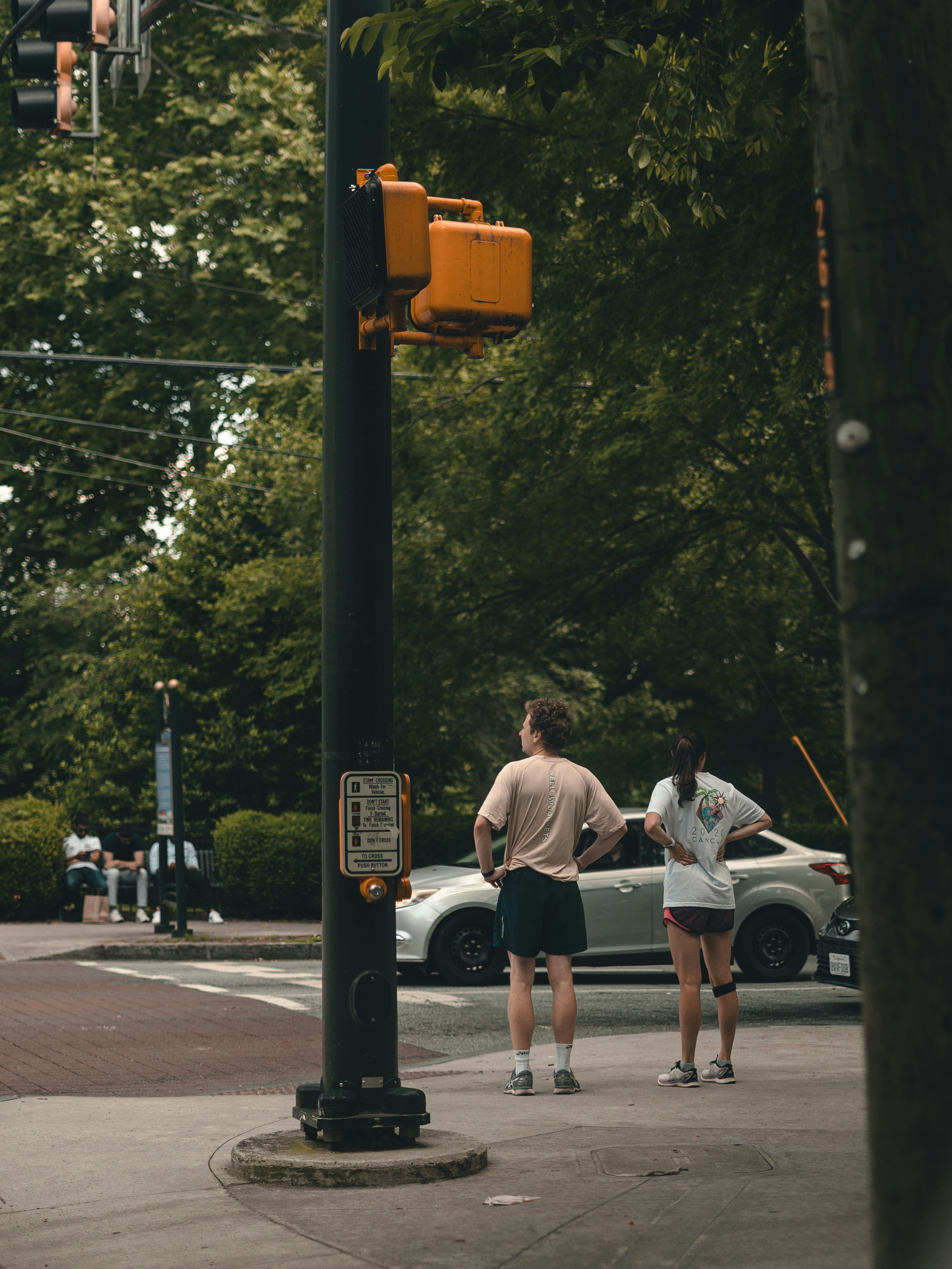 2 women walking on pedestrian lane during daytime